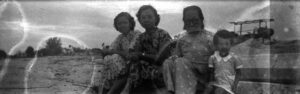 1955 Woon Poh Lin with Grandma at beach
