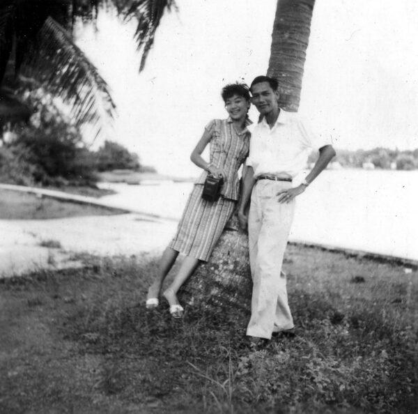 1959 Father Mother beside Coconut Tree
