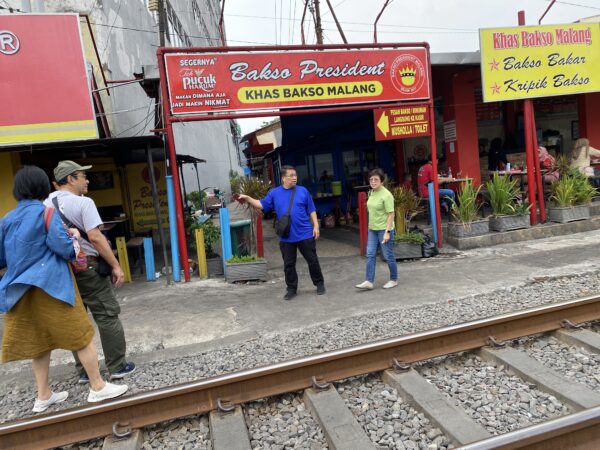 Unique experience - Arriving at Bakso Malang President for lunch, next to railway track