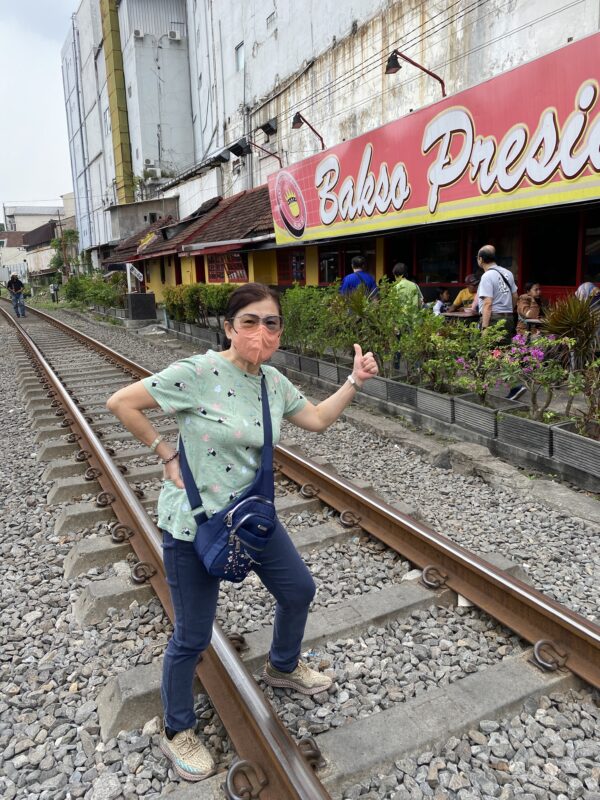 Unique experience - Arriving at Bakso Malang President for lunch, next to railway track